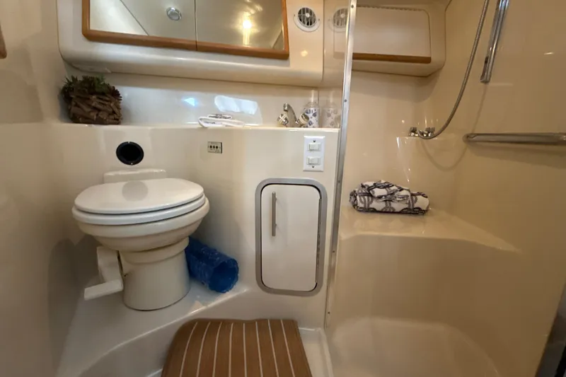 Slide: The Image of Bathroom interior of 1995 Sea Ray Sundancer 370 yacht, featuring toilet and shower. - 37