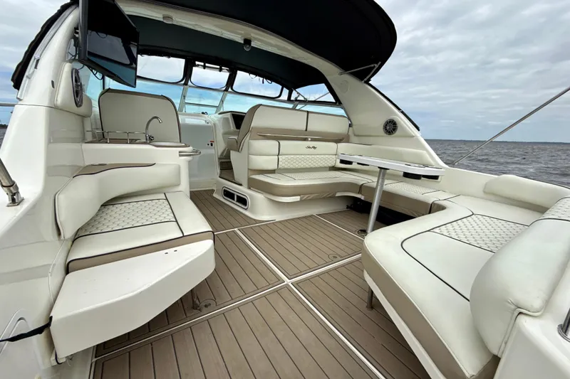 Slide: The Image of Luxurious interior of a 1995 Sea Ray Sundancer 370 yacht with elegant seating and table. - 4