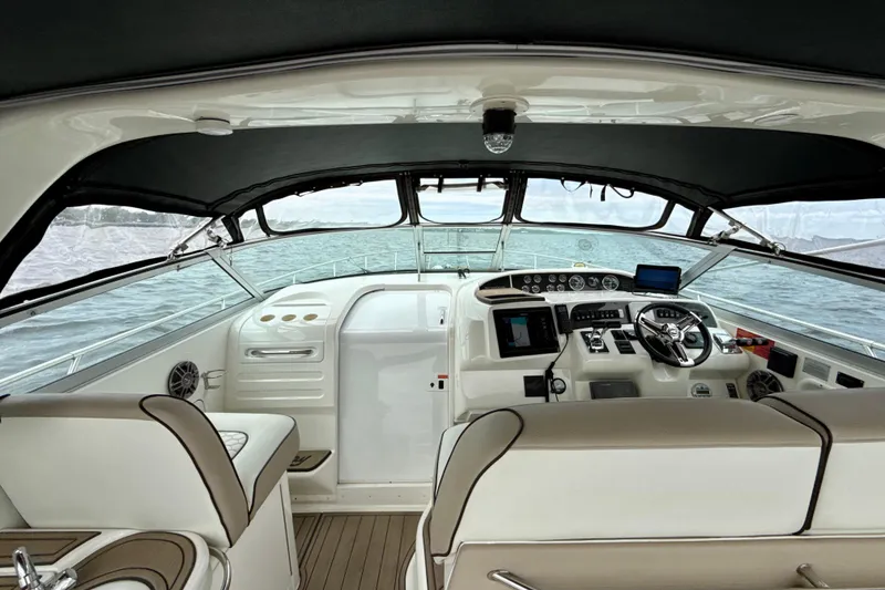Slide: The Image of 1995 Sea Ray Sundancer 370 helm with modern controls and ocean view. - 5