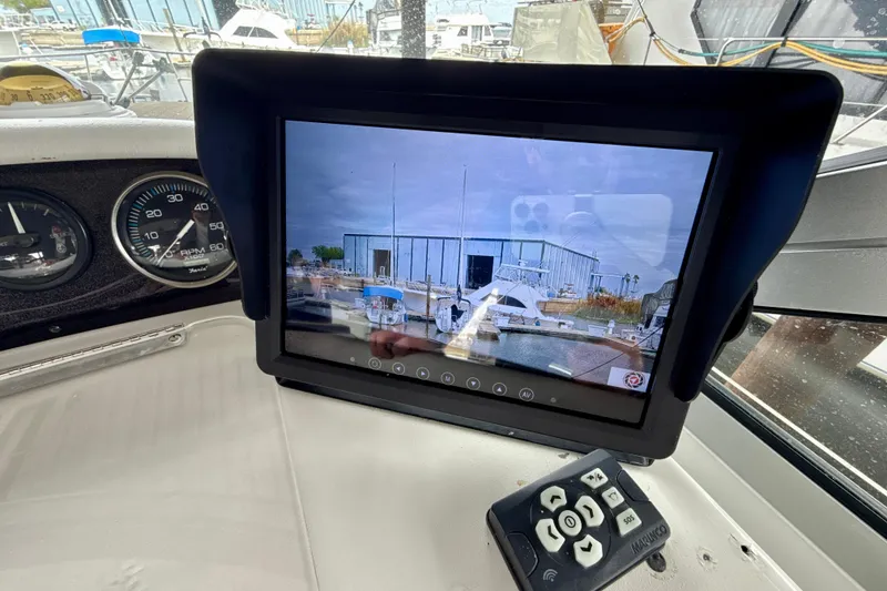 Slide: The Image of Boat dashboard with navigation screen on a 1995 Sea Ray Sundancer 370. - 50