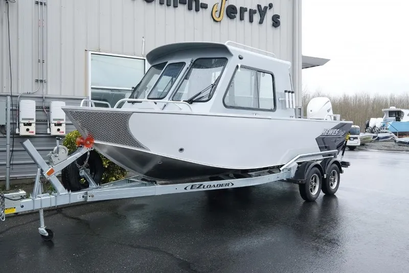 The Image of 2026 Hewescraft 200 ProV boat on trailer outside a building. - 1