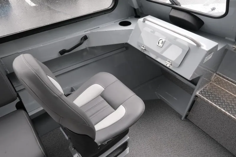 Slide: The Image of Interior of 2026 Hewescraft 200 ProV boat with gray seating and storage compartment. - 15