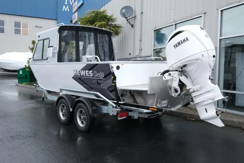 Slide: The Image of 2026 Hewescraft 200 ProV boat with Yamaha outboard motor on a trailer. - 4