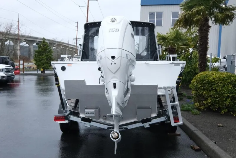 Slide: The Image of 2026 Hewescraft 200 ProV boat with Yamaha 150 outboard motor, parked outdoors. - 5