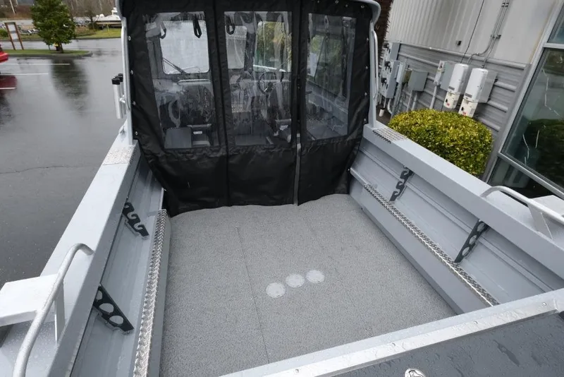 Slide: The Image of 2026 Hewescraft 200 ProV boat interior with spacious deck and protective canopy. - 7