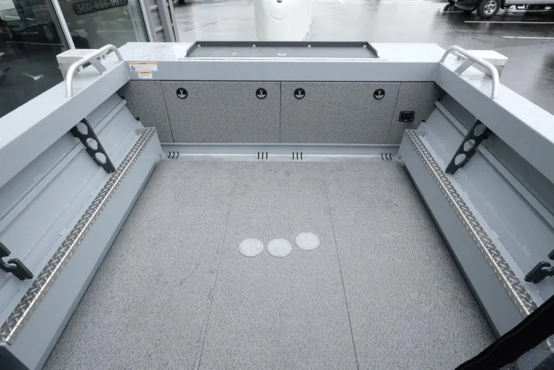 Slide: The Image of 2026 Hewescraft 200 ProV boat interior with spacious deck and storage compartments. - 8