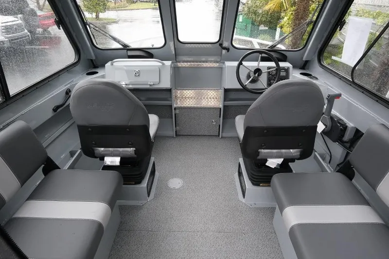 Slide: The Image of Interior of 2026 Hewescraft 200 ProV boat with seating and steering wheel. - 9