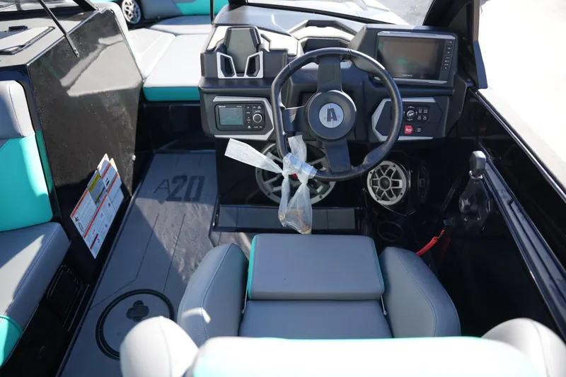 Slide: The Image of 2023 Axis A20 boat interior with modern dashboard and steering wheel. - 12