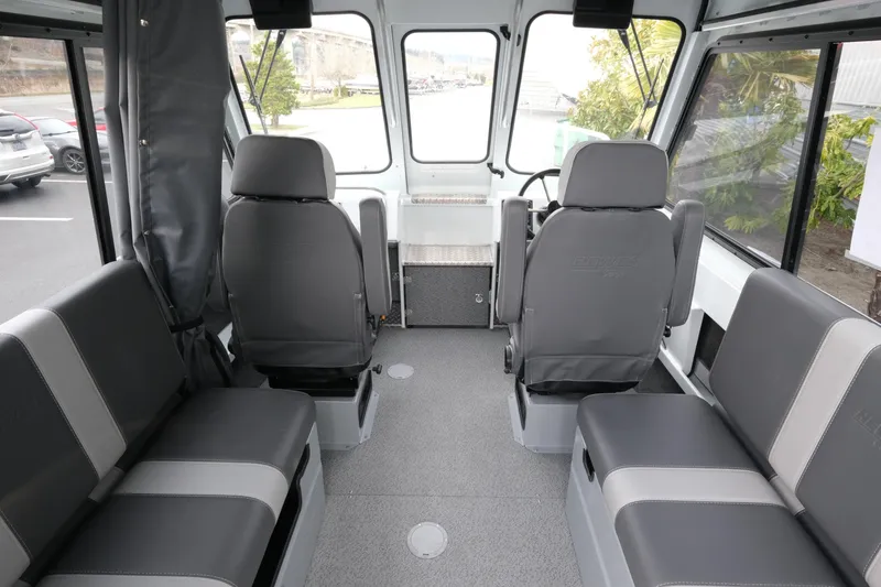 Slide: The Image of Interior of 2026 Hewescraft 210 Sea Runner ET Hardtop, featuring gray seating and spacious layout. - 10