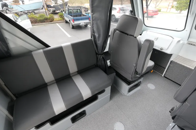 Slide: The Image of Interior of 2026 Hewescraft 210 Sea Runner ET Hardtop, featuring seating and helm area. - 11