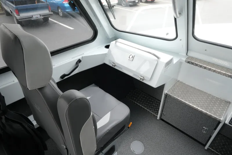 Slide: The Image of 2026 Hewescraft 210 Sea Runner ET Hardtop interior with seating and storage compartments. - 15