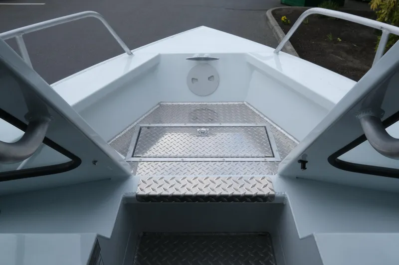Slide: The Image of 2026 Hewescraft 210 Sea Runner ET Hardtop bow with diamond plate flooring. - 16