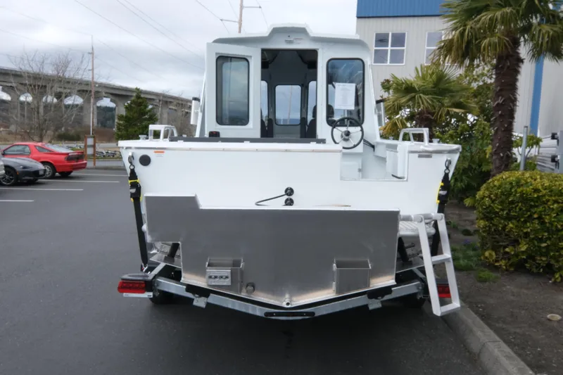 Slide: The Image of 2026 Hewescraft 210 Sea Runner ET Hardtop boat, rear view in parking lot. - 5