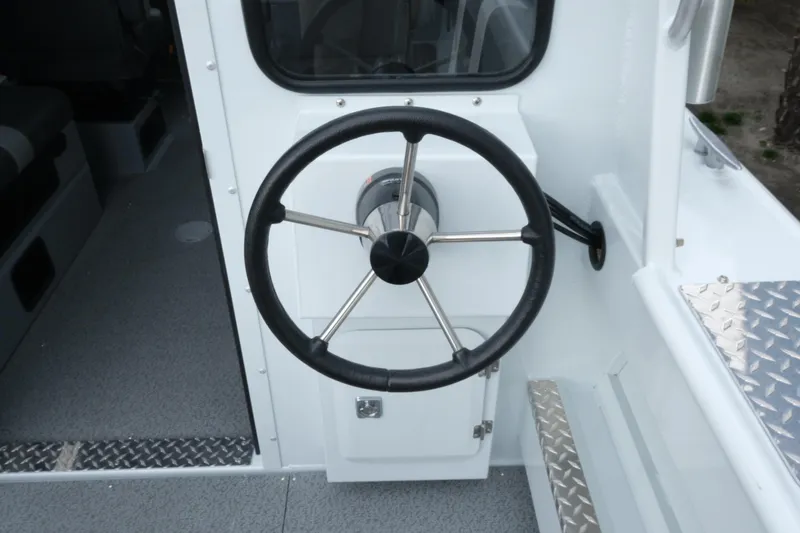 Slide: The Image of Steering wheel of 2026 Hewescraft 210 Sea Runner ET Hardtop boat interior. - 9