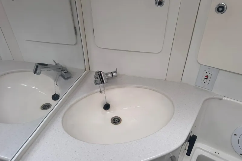 Slide: The Image of Bathroom sink with mirror in a 2003 Bavaria 44 yacht. - 18