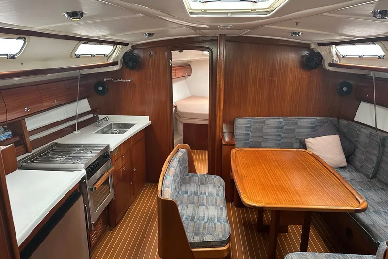Slide: The Image of Interior of 2003 Bavaria 44 yacht with kitchen and dining area. - 20
