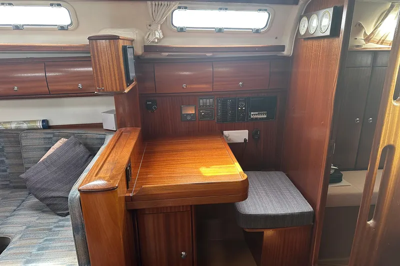 Slide: The Image of Interior of 2003 Bavaria 44 yacht with wooden cabinetry and navigation station. - 29