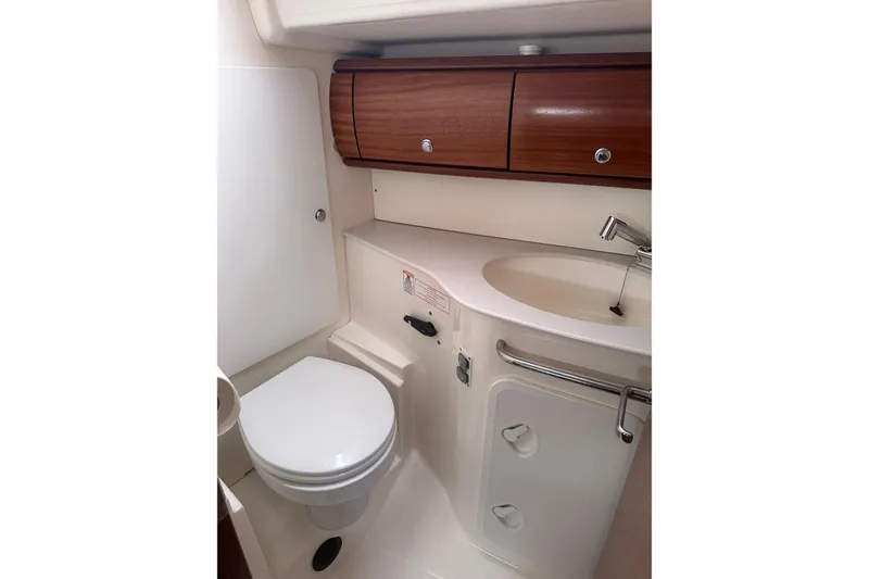 Slide: The Image of Compact bathroom in a 2003 Bavaria 44 yacht with wooden cabinets and modern fixtures. - 33