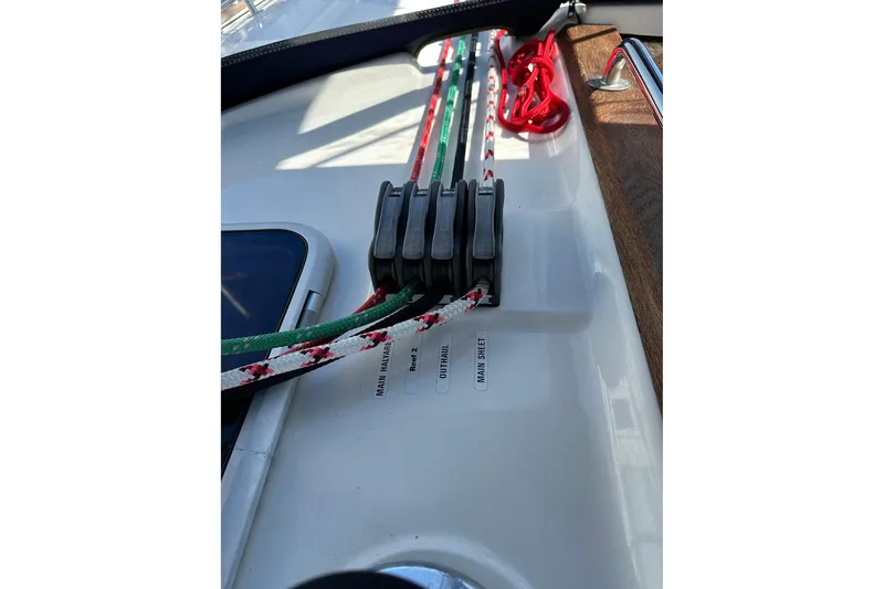Slide: The Image of Sailing ropes and cleats on a 2003 Bavaria 44 yacht deck. - 7