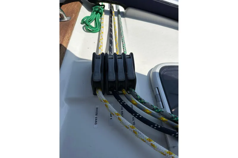 Slide: The Image of Deck of 2003 Bavaria 44 sailboat with rope clutches and colorful lines. - 8