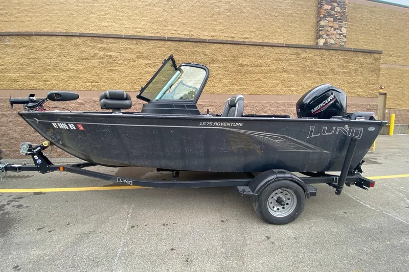 The Image of 2022 Lund 1675 Adventure Sport boat on trailer, parked outdoors. - 0