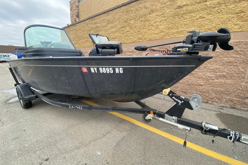 Slide: The Image of 2022 Lund 1675 Adventure Sport boat on trailer, parked outdoors. - 7