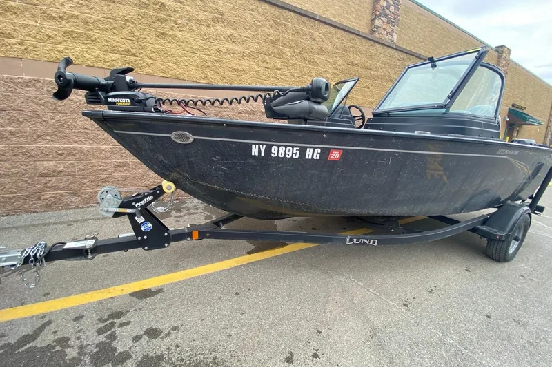 Slide: The Image of 2022 Lund 1675 Adventure Sport boat on trailer, parked outdoors. - 9