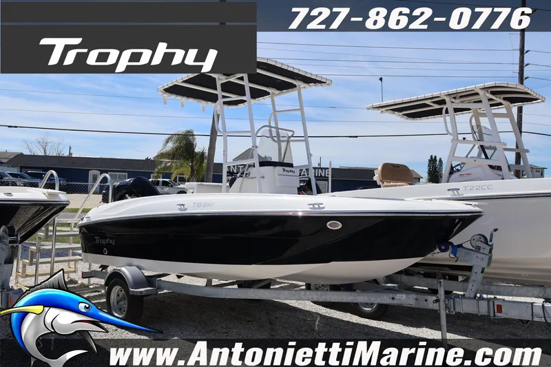 The Image of 2026 Bayliner Trophy T18 boat on trailer at Antonietti Marine dealership. - 1