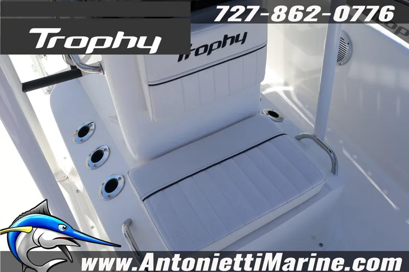 Slide: The Image of 2026 Bayliner Trophy T18 boat interior with seating and rod holders. - 10