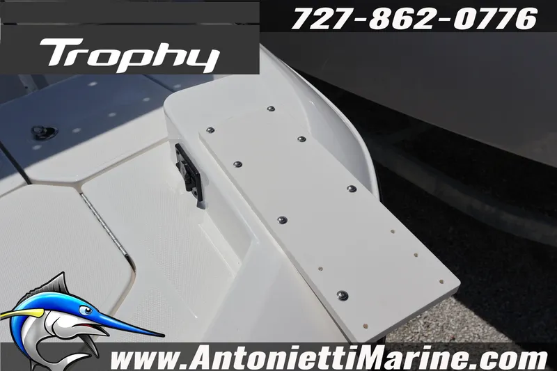 Slide: The Image of 2026 Bayliner Trophy T18 boat deck with contact details and logo. - 4
