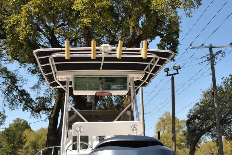 Slide: The Image of 1993 Robalo 2120 Center Console boat with T-top and rod holders. - 11