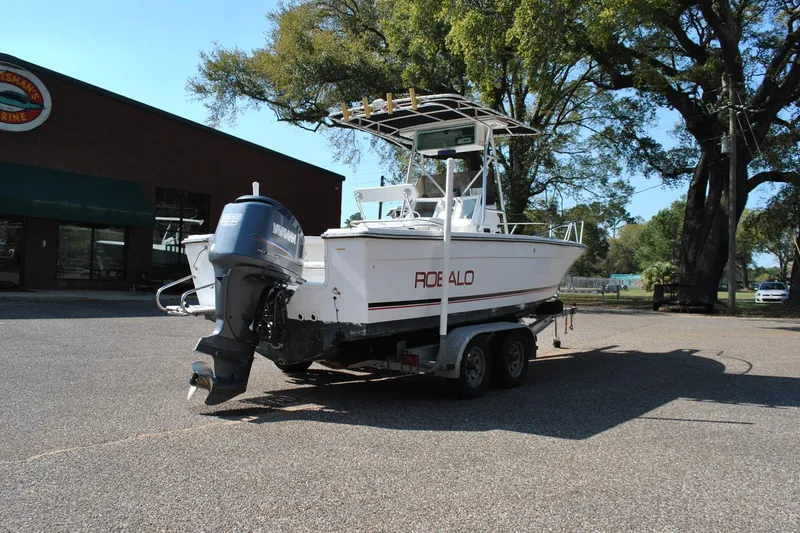 Slide: The Image of 1993 Robalo 2120 Center Console boat on trailer, parked outdoors. - 13