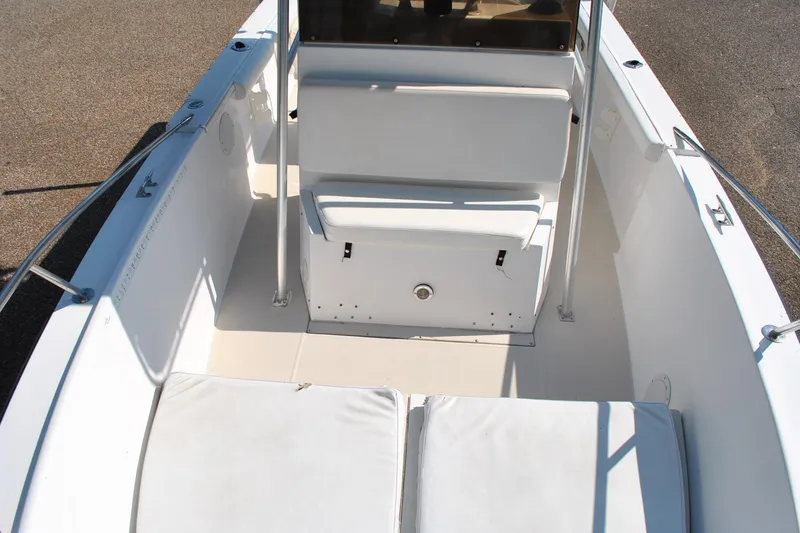 Slide: The Image of 1993 Robalo 2120 Center Console boat interior with white seating and stainless steel railings. - 17