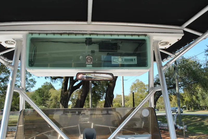 Slide: The Image of 1993 Robalo 2120 Center Console boat with T-top and electronics box. - 24