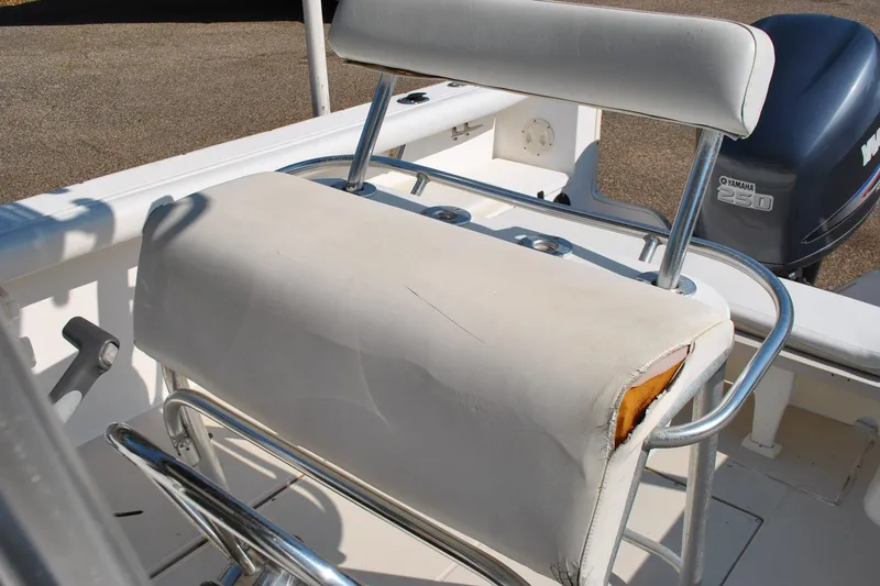 Slide: The Image of 1993 Robalo 2120 Center Console boat seat with visible wear and Yamaha 250 engine. - 25