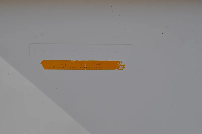 Slide: The Image of 1993 Robalo 2120 Center Console hull identification number with faded orange tape. - 29