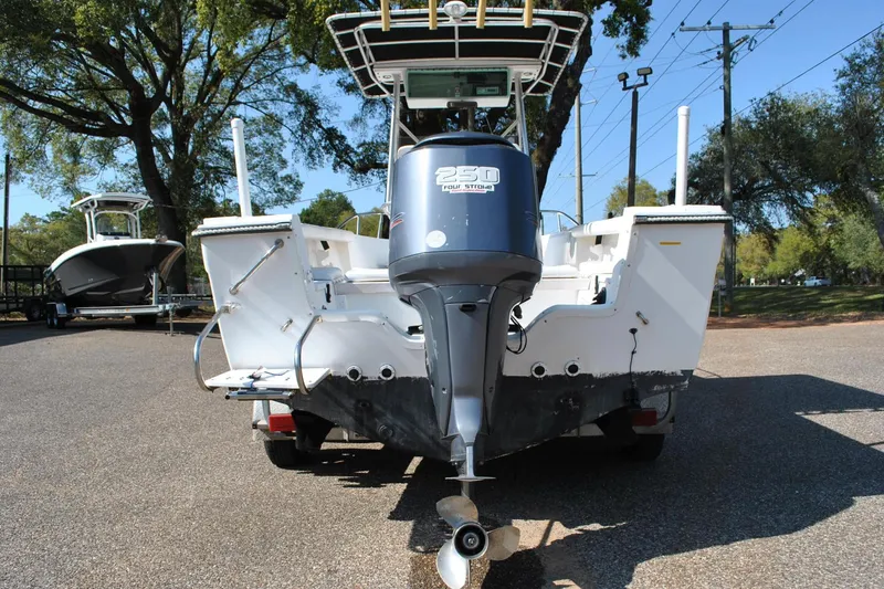 Slide: The Image of 1993 Robalo 2120 Center Console boat with 250 horsepower outboard motor, parked outdoors. - 30