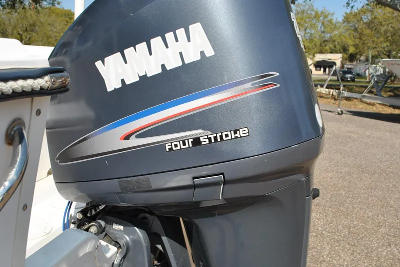 Slide: The Image of Yamaha four-stroke outboard motor on 1993 Robalo 2120 Center Console boat. - 32