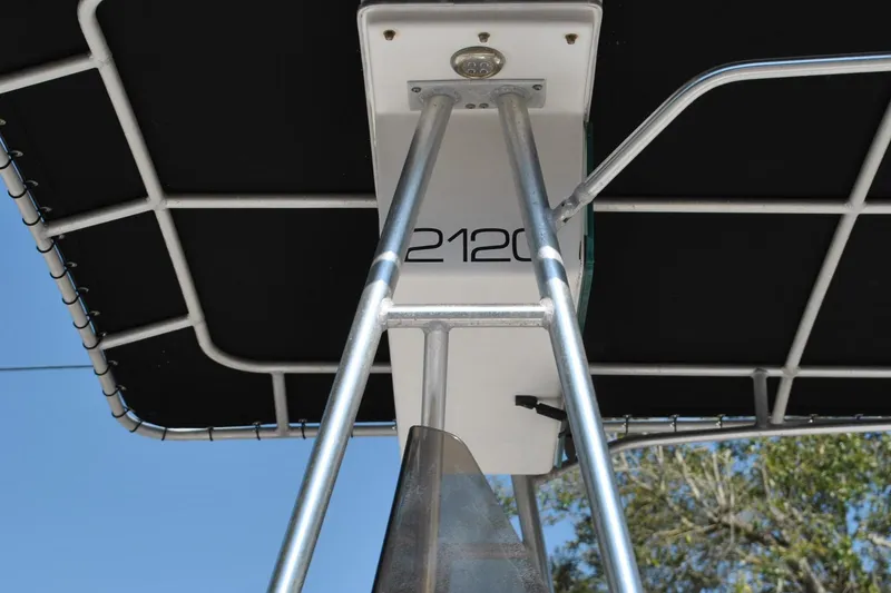 Slide: The Image of 1993 Robalo 2120 Center Console boat with T-top and support structure. - 33