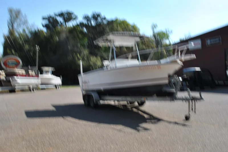 Slide: The Image of Blurry image of a 1993 Robalo 2120 Center Console boat on a trailer. - 5