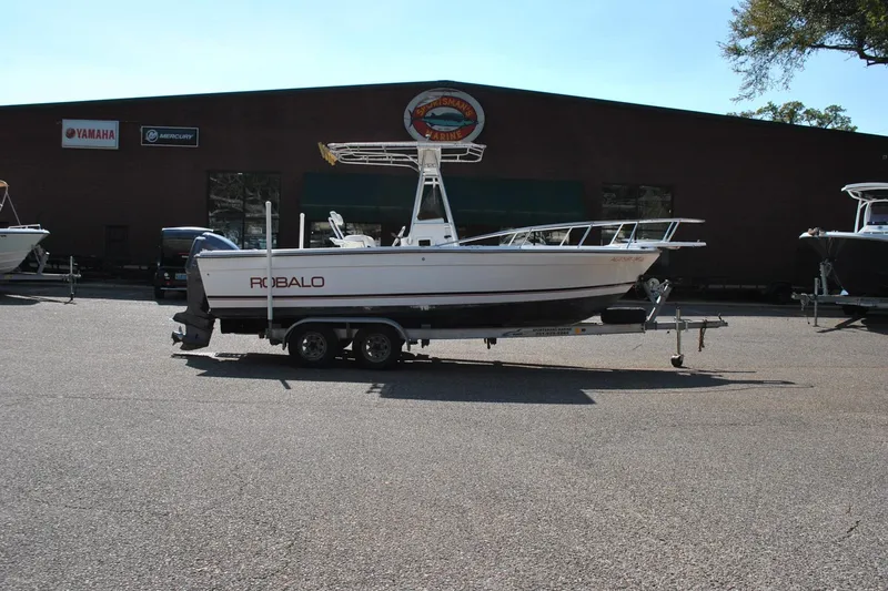 Slide: The Image of 1993 Robalo 2120 Center Console boat on trailer outside dealership. - 6