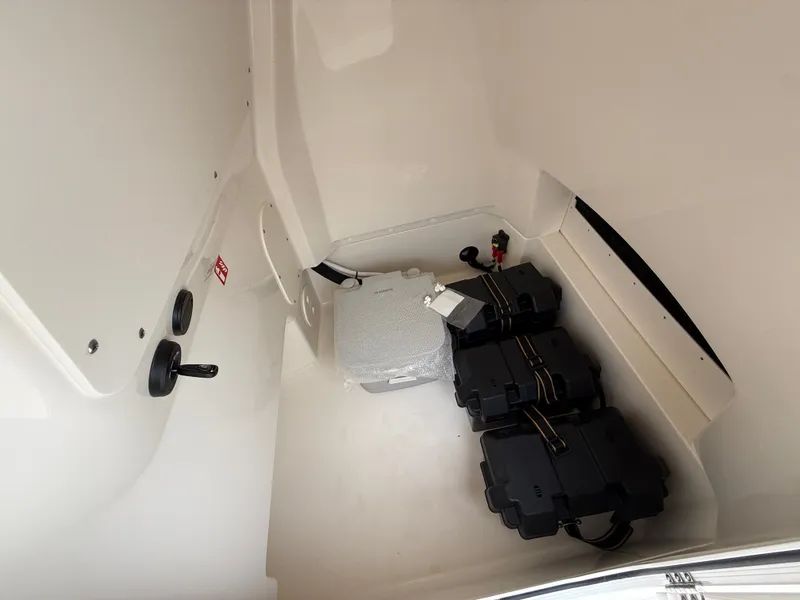 Slide: The Image of Interior of 2026 Boston Whaler 250 Dauntless with batteries. - 12