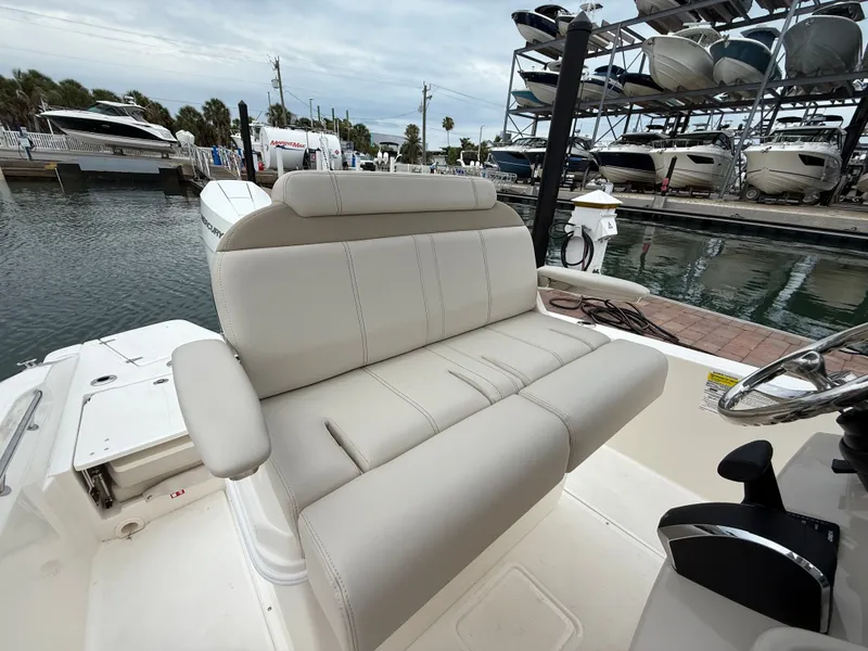Slide: The Image of Boston Whaler 250 Dauntless 2026, comfortable seating area at the marina. - 15