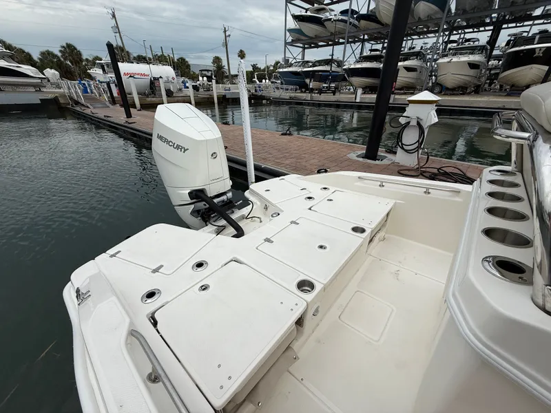 Slide: The Image of Boston Whaler 250 Dauntless 2026 at dock with Mercury engine. - 16