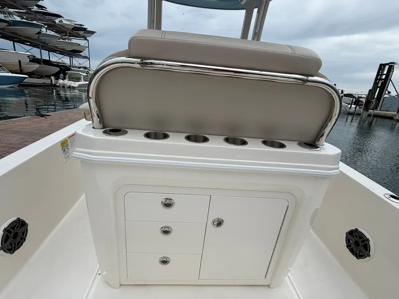 Slide: The Image of Rear view of 2026 Boston Whaler 250 Dauntless with storage compartments. - 17