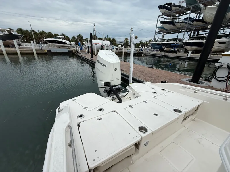 Slide: The Image of Boston Whaler 250 Dauntless 2026 at dock with Mercury engine. - 20