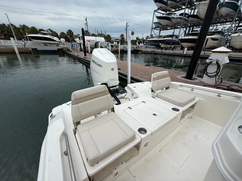 Slide: The Image of Boston Whaler 250 Dauntless 2026 at dock with Mercury engine. - 21