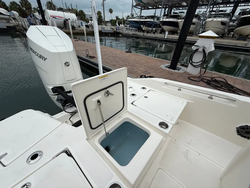 Slide: The Image of Boston Whaler 250 Dauntless 2026 with Mercury engine at dock. - 22