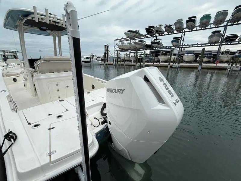 Slide: The Image of 2026 Boston Whaler 250 Dauntless with Mercury engine at dock. - 24