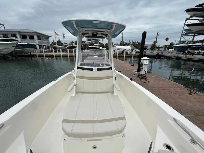 Slide: The Image of Boston Whaler 250 Dauntless 2026 at dock, modern design. - 7